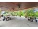 Spacious outdoor pavilion featuring ceiling fans, picnic tables, and views of the surrounding green space, perfect for gatherings at 2772 Latrobe Ct, Mount Pleasant, SC 29466