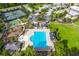 Aerial view of a community pool with a clubhouse, playground, tennis court, basketball court and parking lot at 2772 Latrobe Ct, Mount Pleasant, SC 29466