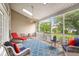 Spacious screened porch with comfortable seating and views of the backyard at 2772 Latrobe Ct, Mount Pleasant, SC 29466