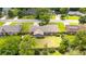 Aerial view of house with large lawn, mature trees, and privacy fence in residential neighborhood at 2912 Doncaster Dr, Charleston, SC 29414