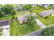 Aerial view of a well-manicured property featuring a lush green lawn, mature tree, and a neatly maintained home in a quiet neighborhood at 2912 Doncaster Dr, Charleston, SC 29414