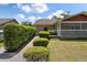 Well-maintained backyard with manicured hedges and walkway leading to the charming screened porch, offering a private outdoor space at 2912 Doncaster Dr, Charleston, SC 29414