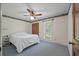 A simply decorated bedroom featuring a bed, window, and wooden closet at 2912 Doncaster Dr, Charleston, SC 29414