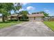 Charming one-story brick home with a two-car garage and a well-maintained lawn and mature landscaping at 2912 Doncaster Dr, Charleston, SC 29414