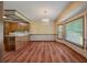 Traditional eat-in kitchen features wood cabinets, laminate counters, and lots of natural light from large windows at 2912 Doncaster Dr, Charleston, SC 29414
