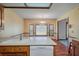 Traditional eat-in kitchen with laminate counters, and wood-look floors under chandelier lighting at 2912 Doncaster Dr, Charleston, SC 29414