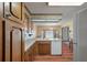 Traditional kitchen with laminate counters, white appliances, and wood cabinets at 2912 Doncaster Dr, Charleston, SC 29414