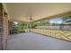An outdoor porch with a ceiling fan, screened walls, brick columns, and geometric railings at 2912 Doncaster Dr, Charleston, SC 29414