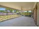A covered porch with a ceiling fan, geometric railings, and a view of the fenced backyard at 2912 Doncaster Dr, Charleston, SC 29414