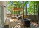 Inviting back porch with a stylish pergola, comfortable seating, and a charming outdoor dining area at 2916 Shadow Ln, North Charleston, SC 29406