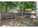 Wonderful backyard featuring a wooden fence, a built-in fire pit, and a charming seating area at 2916 Shadow Ln, North Charleston, SC 29406
