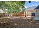 Spacious backyard with a wooden fence, mature trees, and plenty of open space at 2916 Shadow Ln, North Charleston, SC 29406