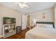 Comfortable bedroom with a bookshelf, TV, mini fridge, and a plush bed at 2916 Shadow Ln, North Charleston, SC 29406