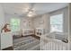 Bright Bedroom with two cribs, a changing table, and lots of natural light from the windows at 2916 Shadow Ln, North Charleston, SC 29406