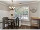 Cozy dining area with a window, featuring a dining table and bench seating, perfect for Gathering meals at 2916 Shadow Ln, North Charleston, SC 29406