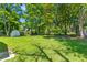 Wide backyard with a storage shed and well-maintained lawn at 300 Oklahoma Pl, Ladson, SC 29456