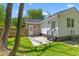 Charming backyard with a cozy patio area and well-maintained landscaping at 300 Oklahoma Pl, Ladson, SC 29456