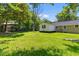 Lush green backyard offering plenty of space for outdoor activities at 300 Oklahoma Pl, Ladson, SC 29456