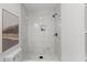 Elegant bathroom shower featuring marble tile and a modern black shower head fixture at 300 Oklahoma Pl, Ladson, SC 29456