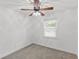 Bright bedroom with neutral carpet and walls, with a ceiling fan and window at 300 Oklahoma Pl, Ladson, SC 29456