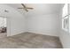 Spacious bedroom with neutral carpet, white walls, and a dining room view at 300 Oklahoma Pl, Ladson, SC 29456
