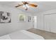 Bright bedroom with a ceiling fan, closet and a window overlooking the yard at 300 Oklahoma Pl, Ladson, SC 29456