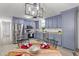 Open kitchen featuring stainless steel appliances, blue cabinets and a table for dining at 300 Oklahoma Pl, Ladson, SC 29456