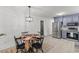 Open kitchen featuring stainless steel appliances, blue cabinets and a table for dining at 300 Oklahoma Pl, Ladson, SC 29456