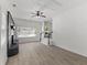 Spacious living room featuring an updated fireplace, natural light, and a staircase at 300 Oklahoma Pl, Ladson, SC 29456