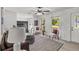 Sunlit living space with a view of the fireplace, neutral walls, and comfortable seating at 300 Oklahoma Pl, Ladson, SC 29456