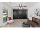 Well-lit living room showcases a dark accent wall, stylish furniture, and an inviting atmosphere at 300 Oklahoma Pl, Ladson, SC 29456