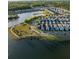 Picturesque aerial view of a colorful home community nestled around a beautiful lake at 3046 Sweetleaf Ln, Johns Island, SC 29455