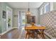 Bright dining room with modern wallpaper and plenty of natural light at 3046 Sweetleaf Ln, Johns Island, SC 29455
