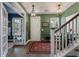 Bright entryway featuring hardwood floors, decorative lighting, and an open view of the living space at 3046 Sweetleaf Ln, Johns Island, SC 29455