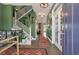 Inviting entryway with elegant staircase, stylish decor, and hardwood floors, creating a warm welcome at 3046 Sweetleaf Ln, Johns Island, SC 29455