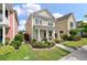 Charming two-story home with inviting front porch and landscaped yard, enhancing curb appeal at 3046 Sweetleaf Ln, Johns Island, SC 29455