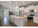 Modern kitchen with granite countertops, stainless steel appliances, and stylish pendant lighting, perfect for cooking at 3046 Sweetleaf Ln, Johns Island, SC 29455