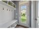 Mud room with storage, bench, and coat hooks at 3046 Sweetleaf Ln, Johns Island, SC 29455