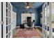 Stylish home office with blue walls, patterned accent, and ample natural light, perfect for productivity at 3046 Sweetleaf Ln, Johns Island, SC 29455