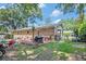 This backyard features an outdoor seating area with a grill at 308 Ashley Dr, Summerville, SC 29485
