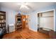 This bedroom has wood floors, a storage unit, and a closet for storage at 308 Ashley Dr, Summerville, SC 29485