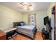 Relaxing bedroom with hardwood floors, soft lighting, and a cozy atmosphere at 308 Ashley Dr, Summerville, SC 29485