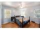 This is a calm bedroom with light blue walls, a vintage bed, and hardwood floors at 308 Ashley Dr, Summerville, SC 29485