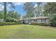 Well-kept brick home with a verdant lawn and ample natural light at 308 Ashley Dr, Summerville, SC 29485