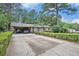 Traditional brick home with an expansive driveway and manicured front yard at 308 Ashley Dr, Summerville, SC 29485
