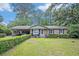 Charming brick home featuring a well-maintained lawn and lush landscaping at 308 Ashley Dr, Summerville, SC 29485
