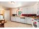 Bright kitchen with ample counter space, white cabinetry, and tiled floor at 308 Ashley Dr, Summerville, SC 29485