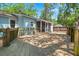 Large wood deck with screened porch overlooking a partially fenced yard at 309 Padgett Loop, Walterboro, SC 29488