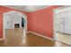 View from dining room into living room, showing hardwood floors, fireplace, and kitchen at 309 Padgett Loop, Walterboro, SC 29488