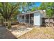 Exterior of home with a screened porch, small deck, and wood fence at 309 Padgett Loop, Walterboro, SC 29488